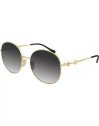 Elegante solbriller med guldfarvet stel