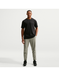 Alsidige Nike Unlimited-Dri-FIT-bukser med lynlåsmanchetter til mænd - grøn